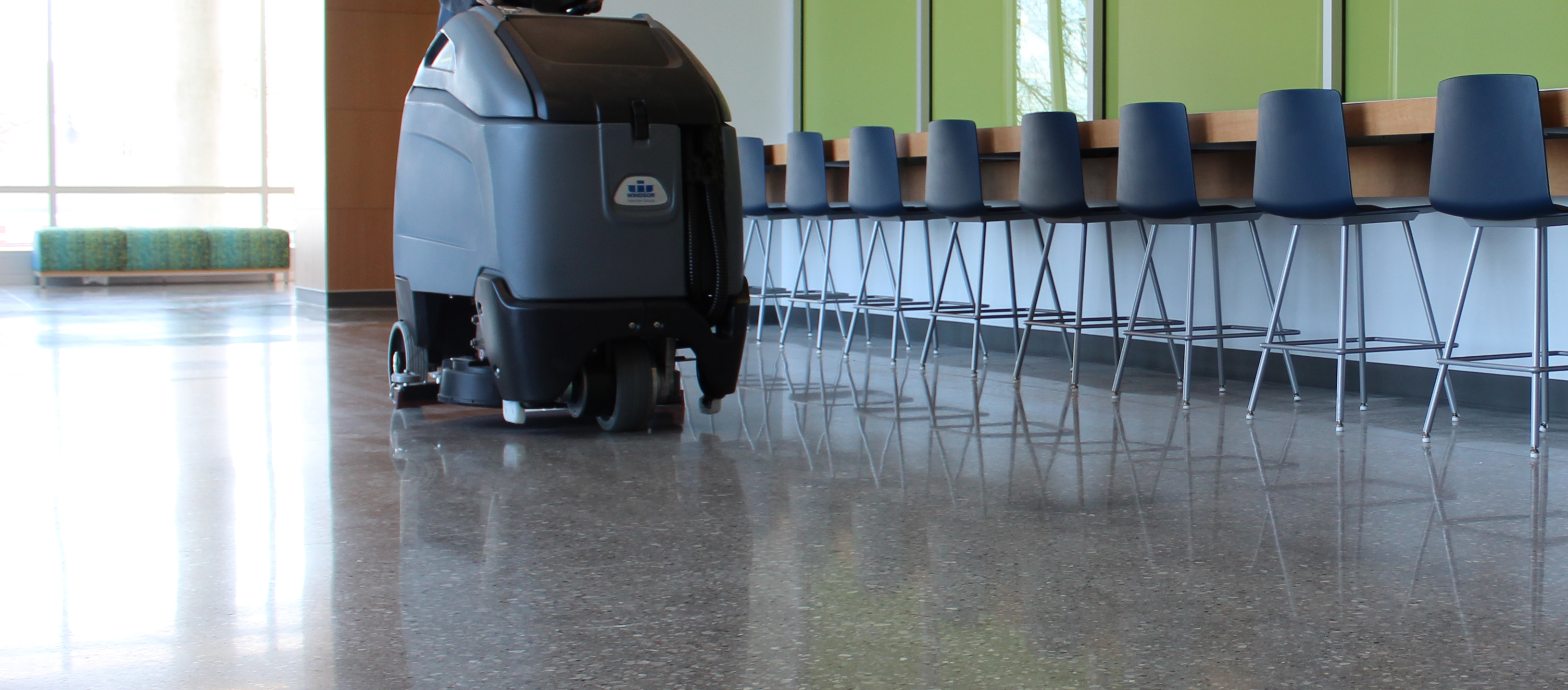 Custodian polishing the floor